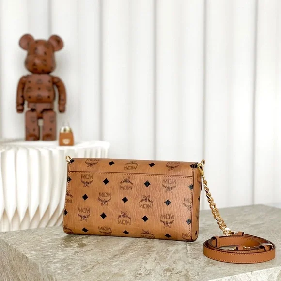 MCM Tan Monogram Clutch with Gold Accent - Picture 3 of 9